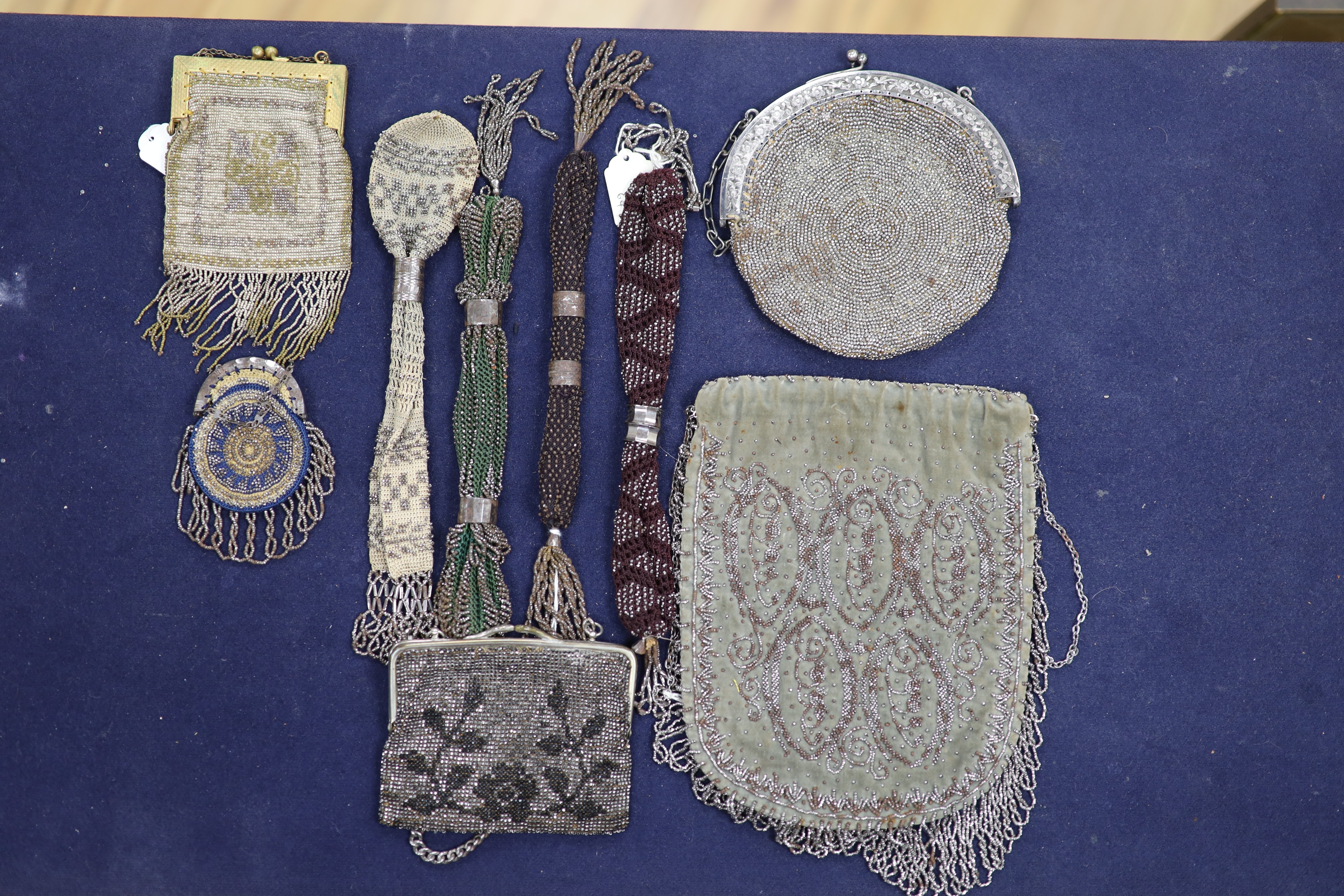 A collection of approximately fifty Victorian and later beadwork, white metal and fabric purses etc.